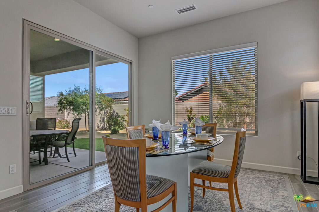 18 Riesling Rancho Mirage, CA 92270 - Photo 3 of 24 a dining room with furniture wooden floor and a potted plant