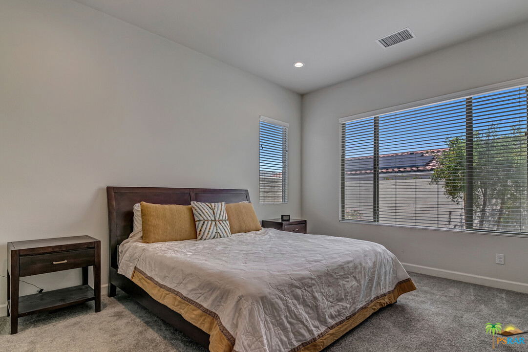 18 Riesling Rancho Mirage, CA 92270 - Photo 8 of 24 a bedroom with a bed and a night stand