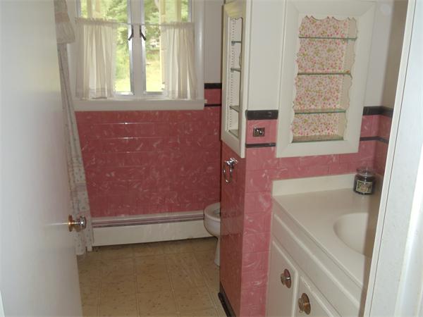 86 Greenwich Road Ware, MA 01082 - Photo 11 of 15 a bathroom with a tub sink and cabinets