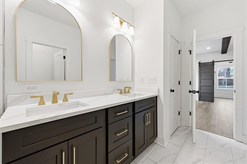 127 Old Alabama Road Southeast Emerson, GA 30137 - Photo 17 of 47 a bathroom with a double vanity sink mirror and shower