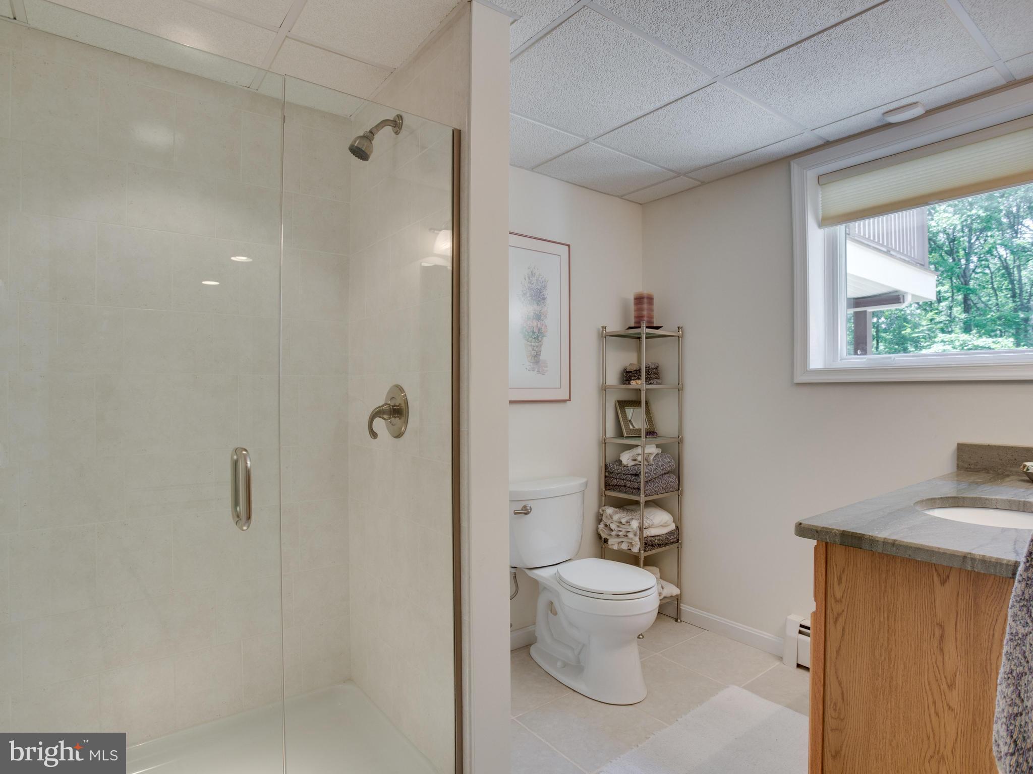 5820 Huntingtown Road Huntingtown, MD 20639 - Photo 20 of 30 Updated bath has granite counters, ceramic shower.
