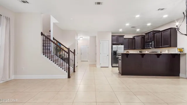 a view of staircase with white walls and railing