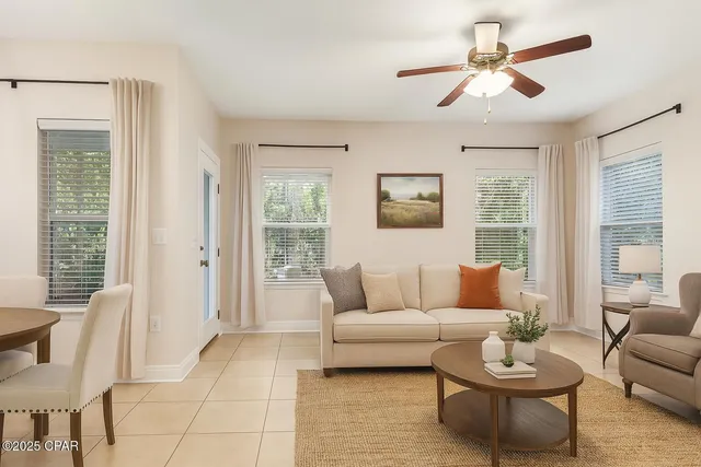 a living room with furniture and a large window