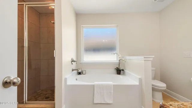 a view of a hallway with wooden door