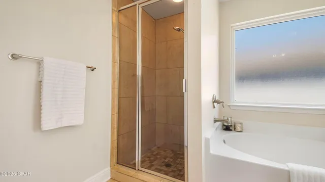 a bathroom with a glass door shower