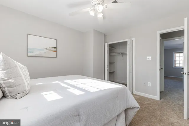 a view of a room with wooden floor and windows