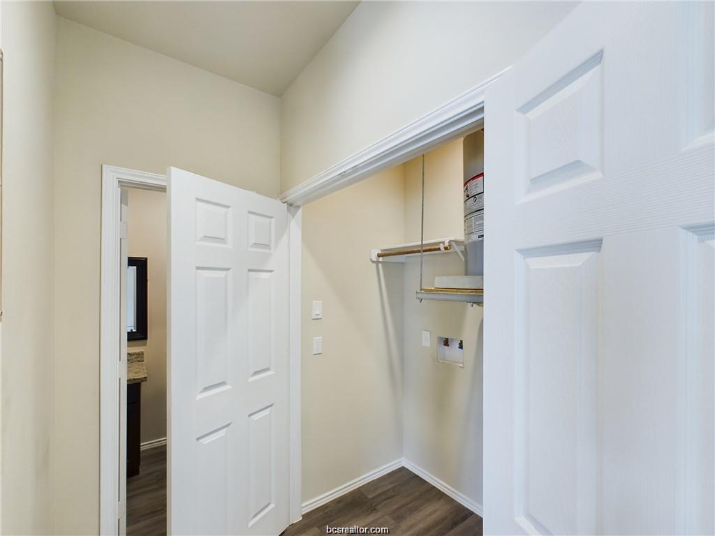 2910 Town Square Avenue, Unit 2114 Bryan, TX 77802 - Photo 5 of 8 a view of a hallway with wooden floor