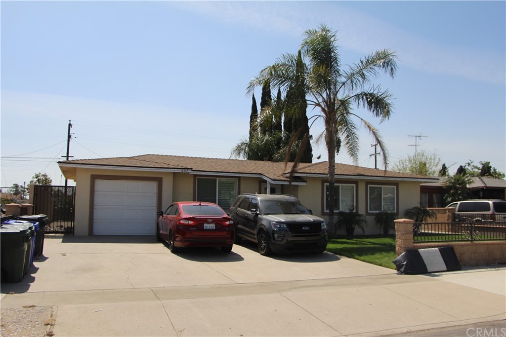 607 West 3rd Street Rialto, CA 92376 - Photo 1 of 1 a car parked in front of a house