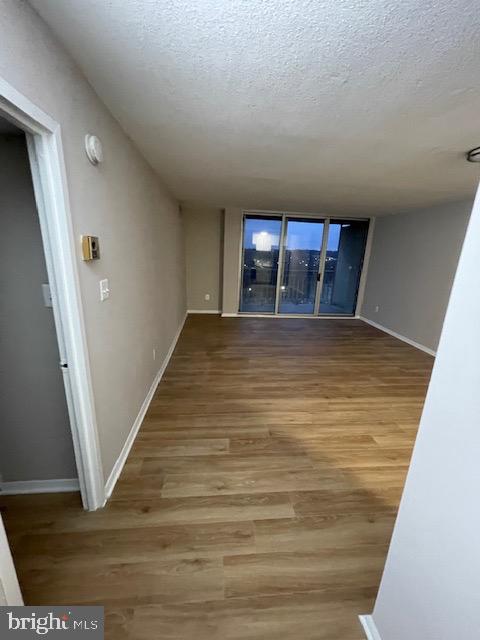 1836 Metzerott Road, Unit 1516 Hyattsville, MD 20783 - Photo 14 of 26 a view of an empty room and wooden floor