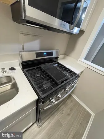 a close up of a stove top oven sitting inside of a kitchen