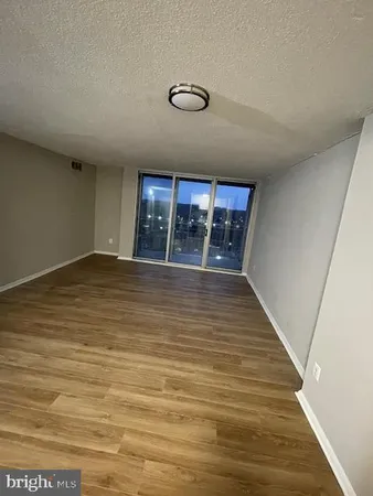 a view of a livingroom with wooden floor