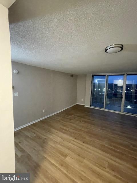 1836 Metzerott Road, Unit 1516 Hyattsville, MD 20783 - Photo 24 of 26 a view of empty room with wooden floor