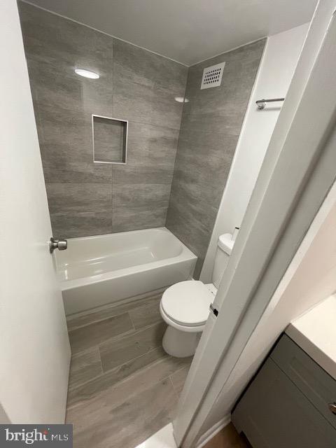 1836 Metzerott Road, Unit 1516 Hyattsville, MD 20783 - Photo 5 of 26 a bathroom with a toilet and a shower