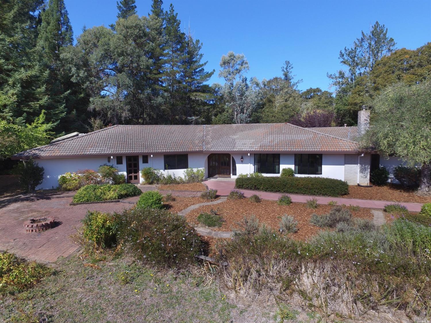4041 Bones Road Sebastopol, CA 95472 - Photo 1 of 1 front view of a house with yard and trees