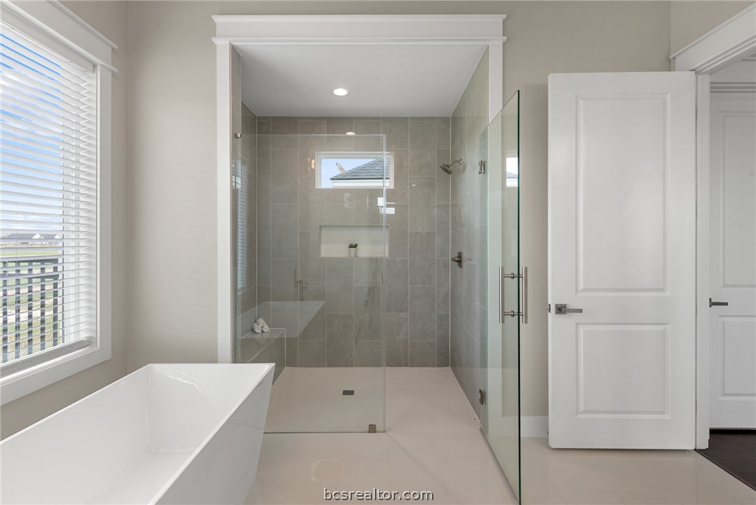 7844 Mathis Crk Drive Bryan, TX 77808 - Photo 27 of 48 a bathroom with a bathtub and shower