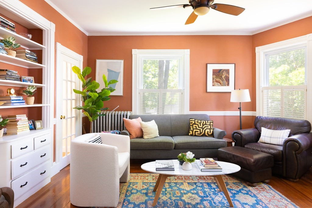 42 Stanton Road, Unit 1 Brookline, MA 02445 - Photo 1 of 16 a living room with furniture and a large window