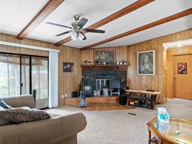 a kitchen with refrigerator and cabinets