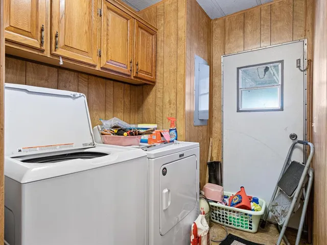 a bathroom with a double vanity sink mirror and toilet