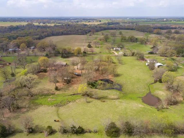 a view of a lake with a yard