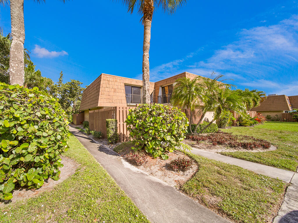 5992 Southeast Riverboat Drive, Unit 537 Stuart, FL 34997 - Photo 2 of 14 a street sign on the side of building
