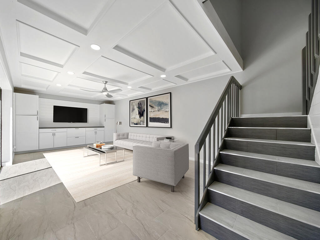 5992 Southeast Riverboat Drive, Unit 537 Stuart, FL 34997 - Photo 6 of 14 a view of a livingroom with furniture and staircase