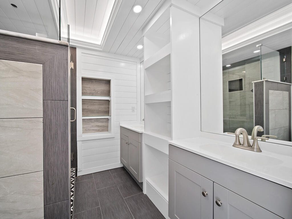 5992 Southeast Riverboat Drive, Unit 537 Stuart, FL 34997 - Photo 10 of 14 a bathroom with a sink and a mirror