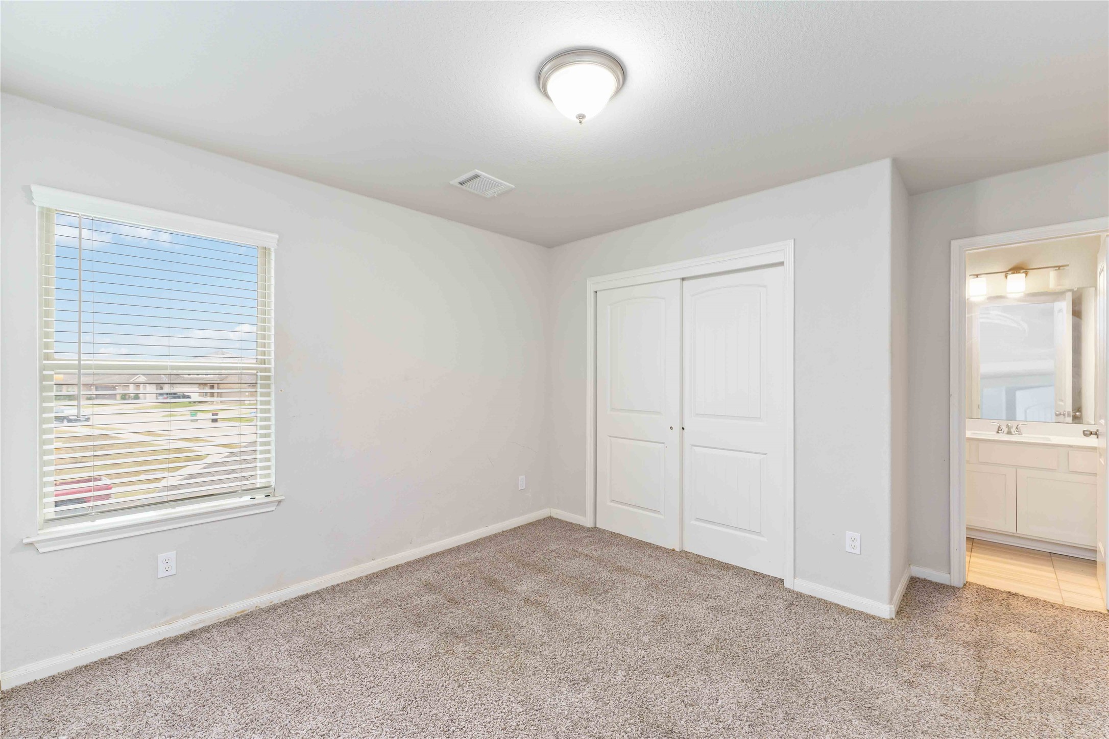 7002 Victorville Drive Rosharon, TX 77583 - Photo 14 of 27 a view of an empty room with a window