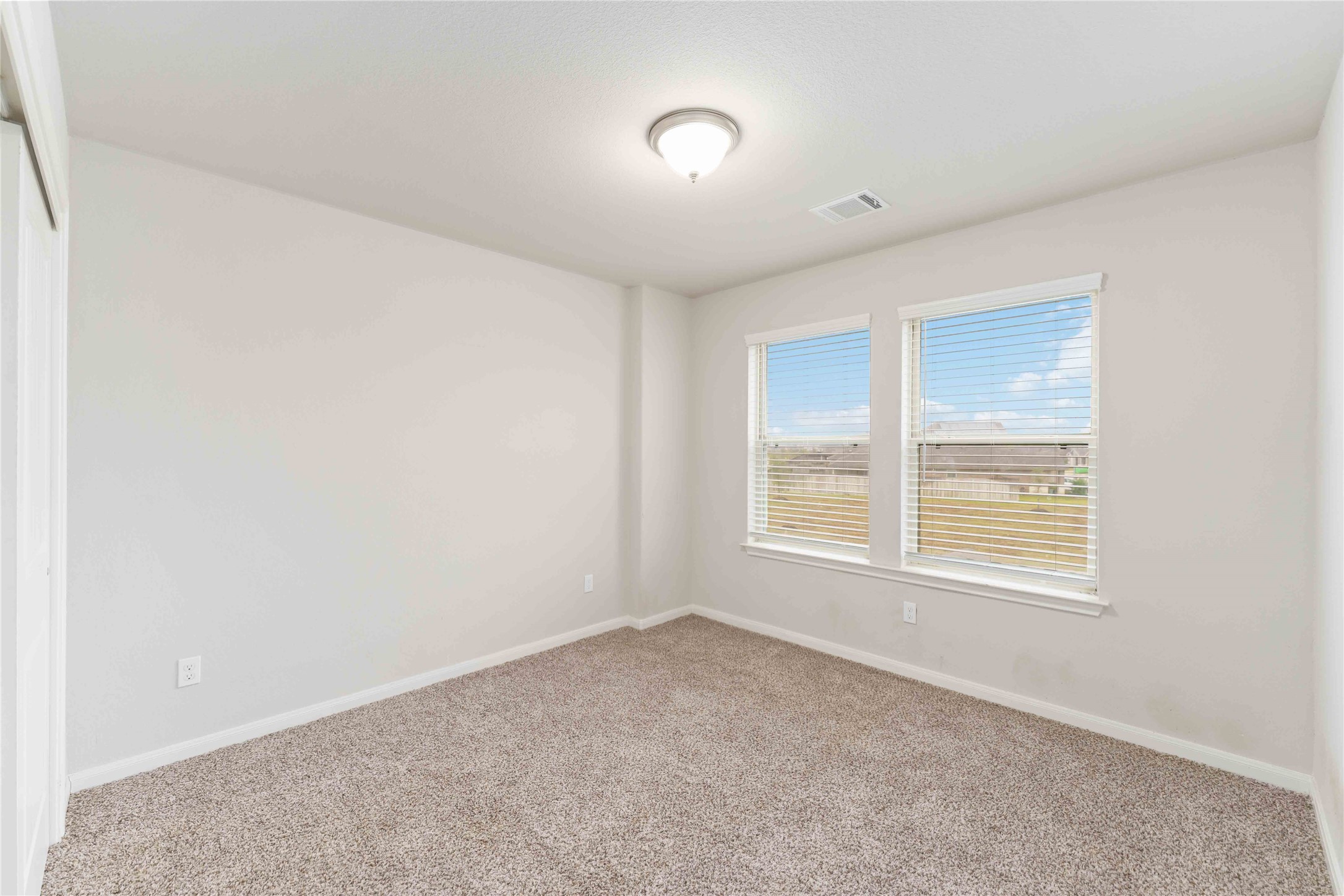 7002 Victorville Drive Rosharon, TX 77583 - Photo 18 of 27 a view of an empty room with a window