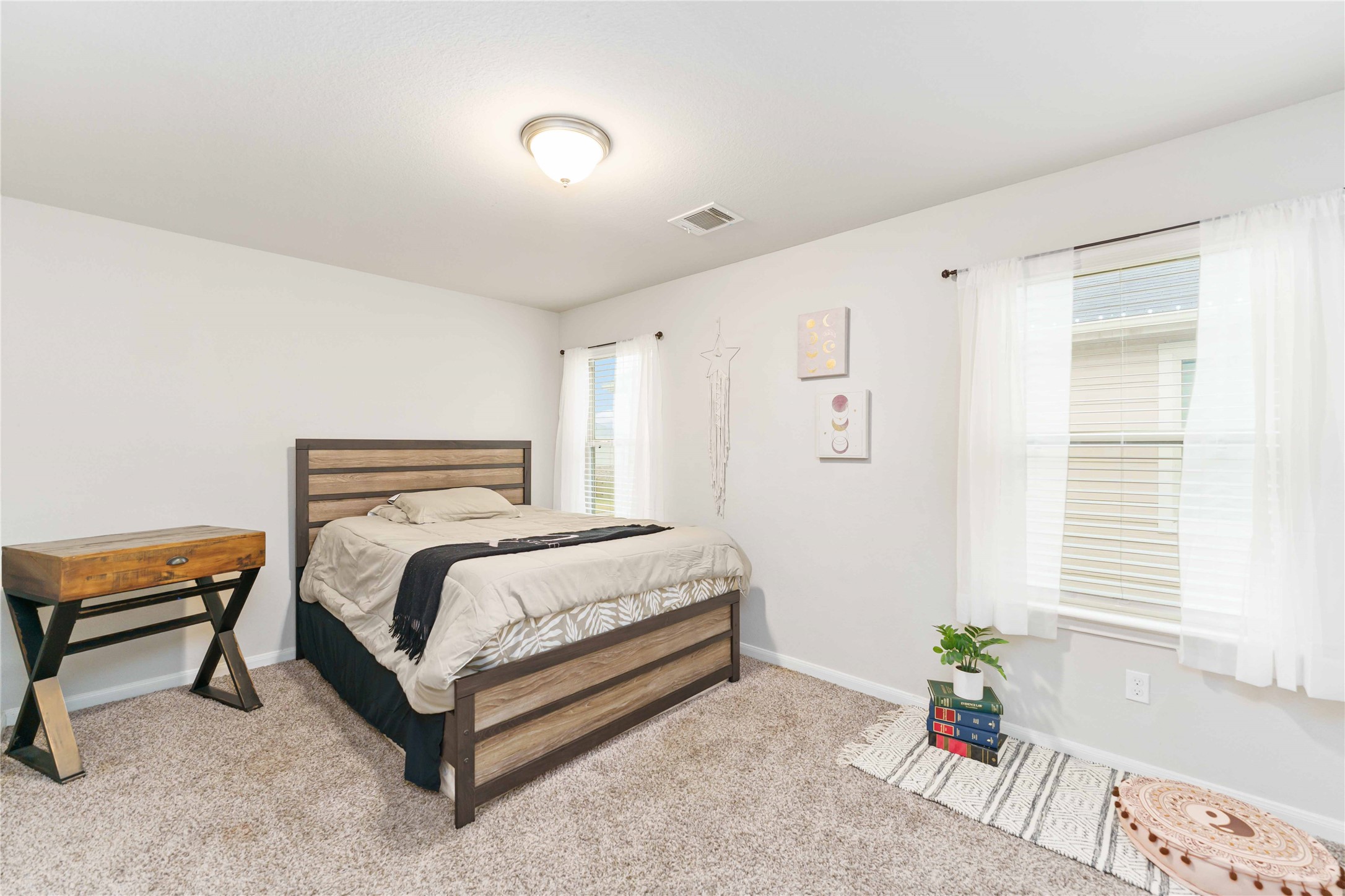 7002 Victorville Drive Rosharon, TX 77583 - Photo 19 of 27 a bedroom with a bed and a window