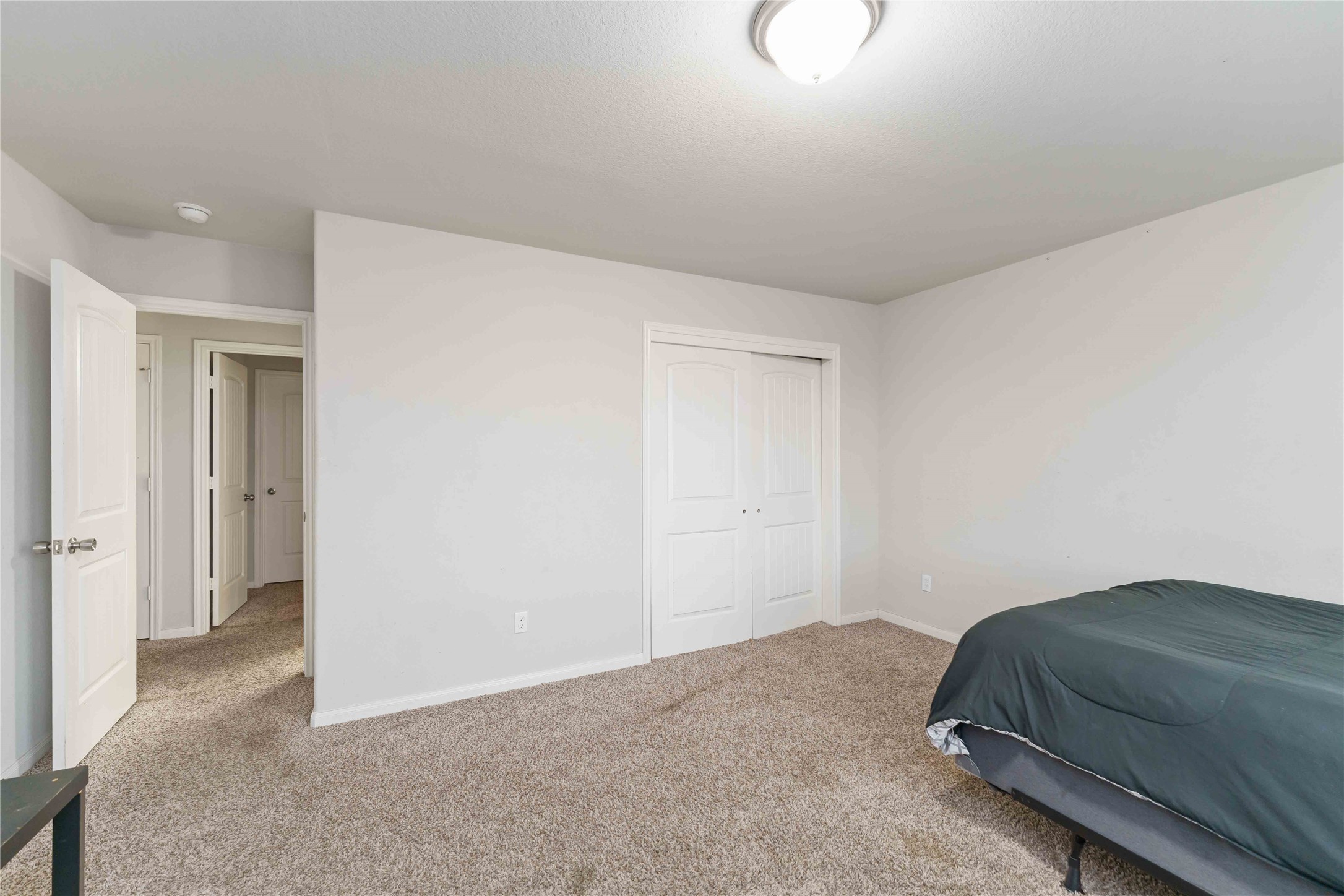 7002 Victorville Drive Rosharon, TX 77583 - Photo 22 of 27 a bedroom with a bed and cabinets