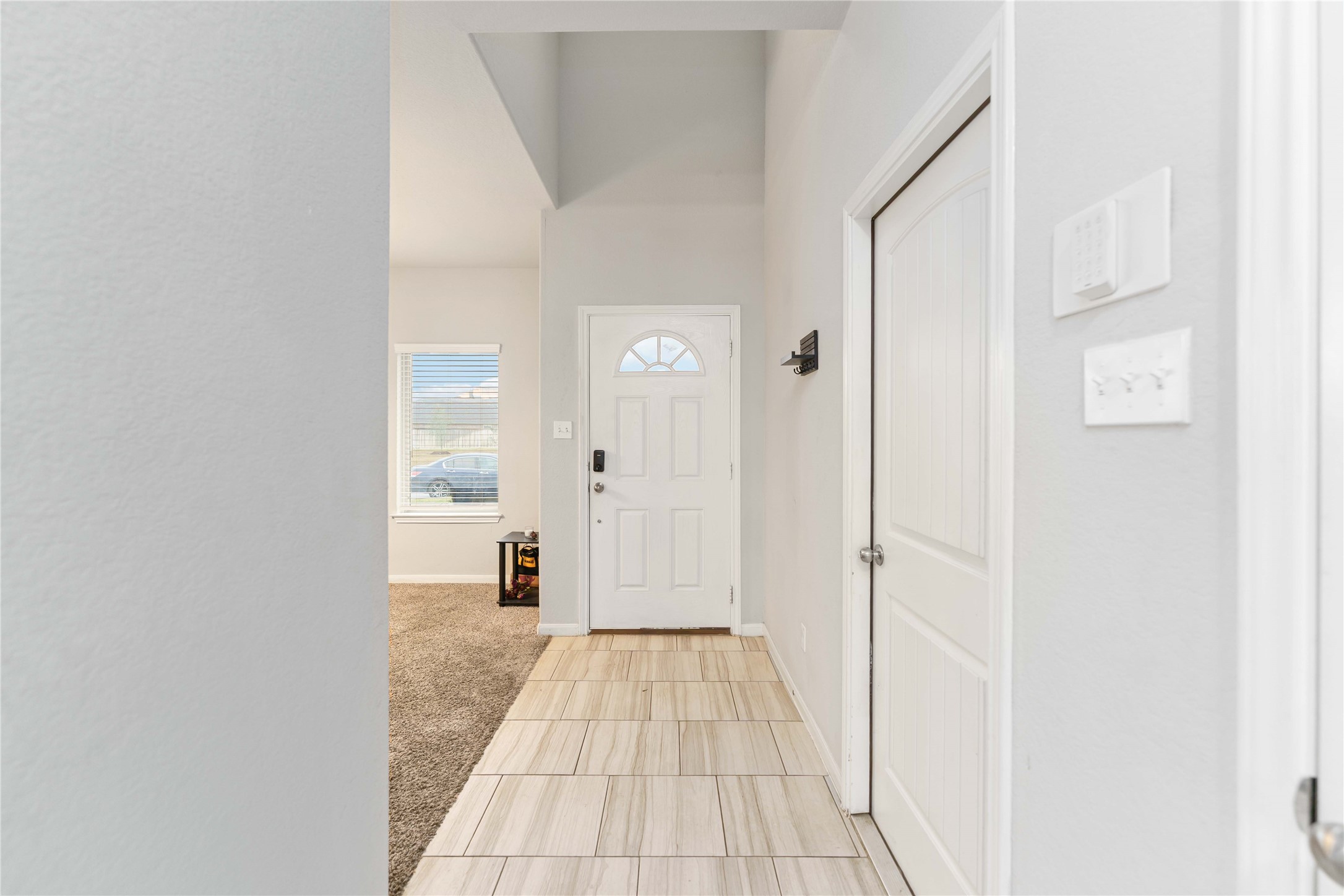 7002 Victorville Drive Rosharon, TX 77583 - Photo 9 of 27 a view of a hallway with wooden shelves
