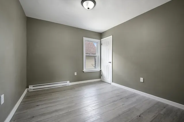 a bathroom with a toilet sink vanity tub and shower