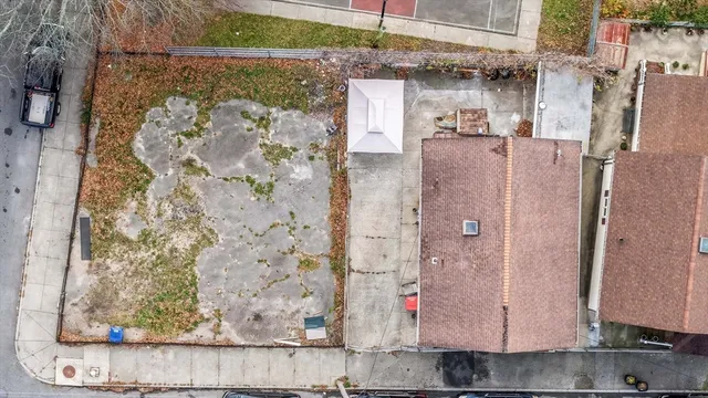 a front view of a building with parking space