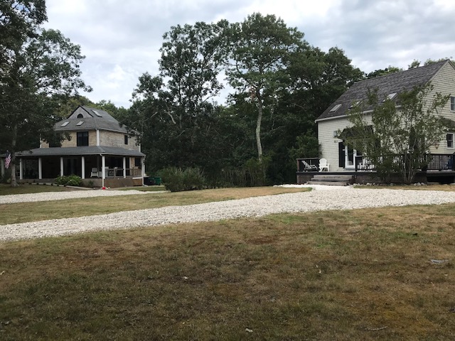 95 Whalers Walk Edgartown, MA 02539 - Photo 1 of 33 a front view of a house with a yard