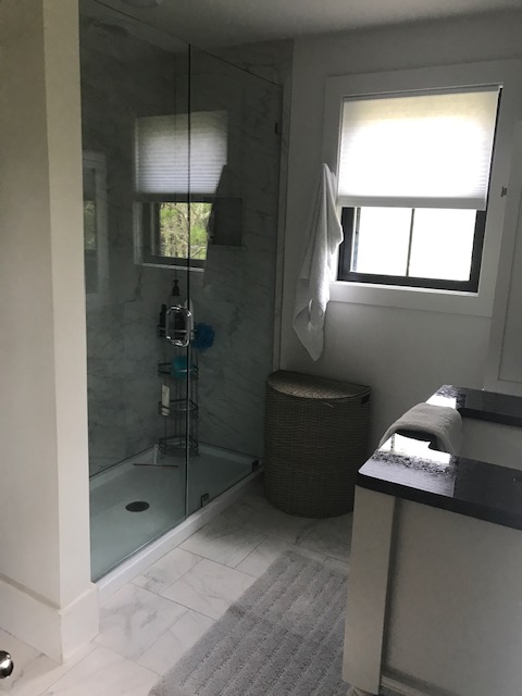 95 Whalers Walk Edgartown, MA 02539 - Photo 11 of 33 a bathroom with a sink a toilet and shower