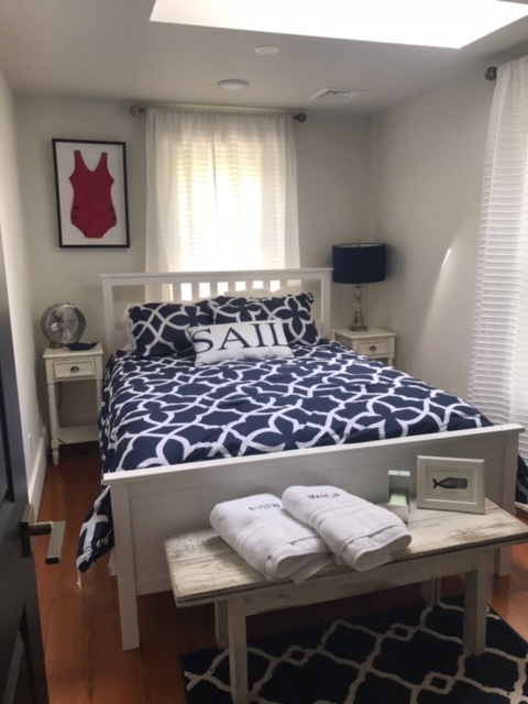 95 Whalers Walk Edgartown, MA 02539 - Photo 12 of 33 a bed sitting in a bedroom next to a window