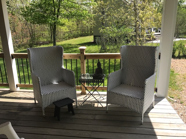 95 Whalers Walk Edgartown, MA 02539 - Photo 16 of 33 a view of a patio with a table chairs and a floor to ceiling window