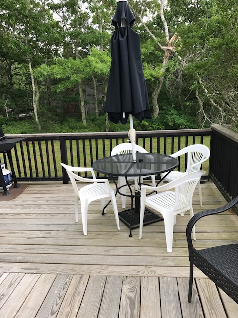 95 Whalers Walk Edgartown, MA 02539 - Photo 28 of 33 a view of balcony with wooden floor and outdoor seating