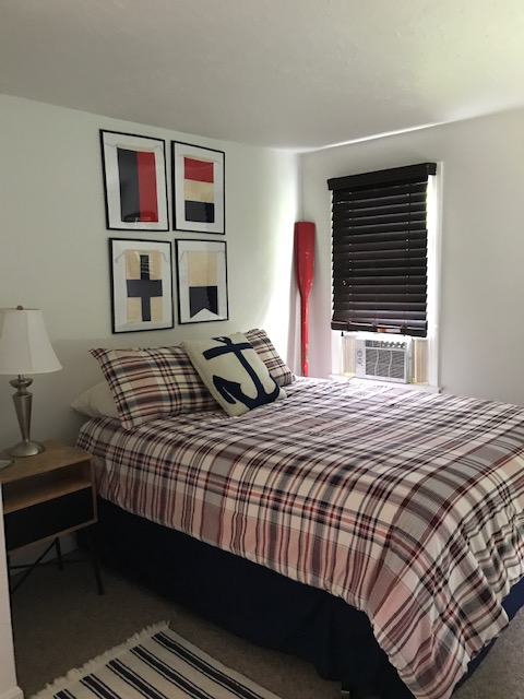 95 Whalers Walk Edgartown, MA 02539 - Photo 32 of 33 a bedroom with a bed and a large window