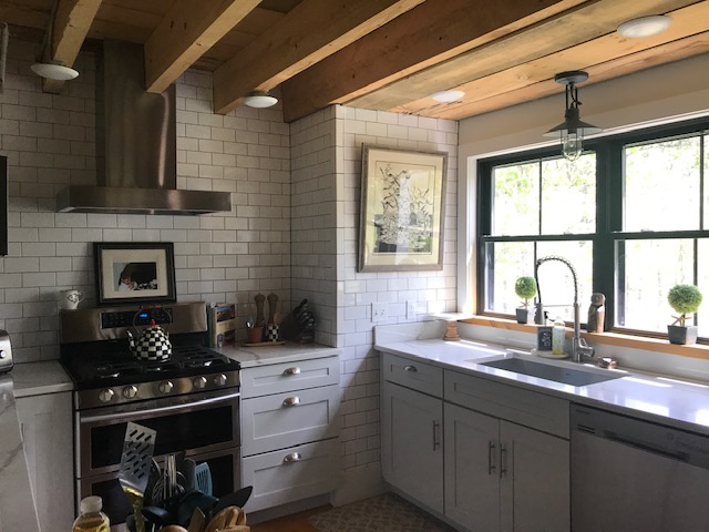 95 Whalers Walk Edgartown, MA 02539 - Photo 8 of 33 a kitchen with sink stove and cabinets