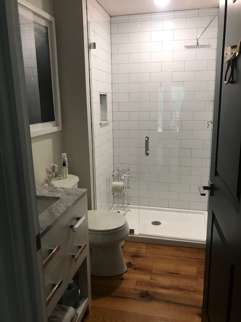 95 Whalers Walk Edgartown, MA 02539 - Photo 10 of 33 a bathroom with a shower a sink and a mirror