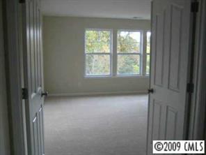 1037 Ridgehaven Road Waxhaw, NC 28173 - Photo 6 of 8 a view of an empty room with a window