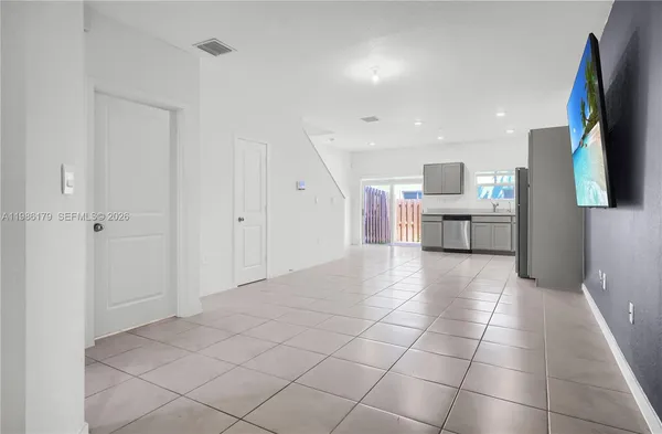 a kitchen with a refrigerator sink and microwave