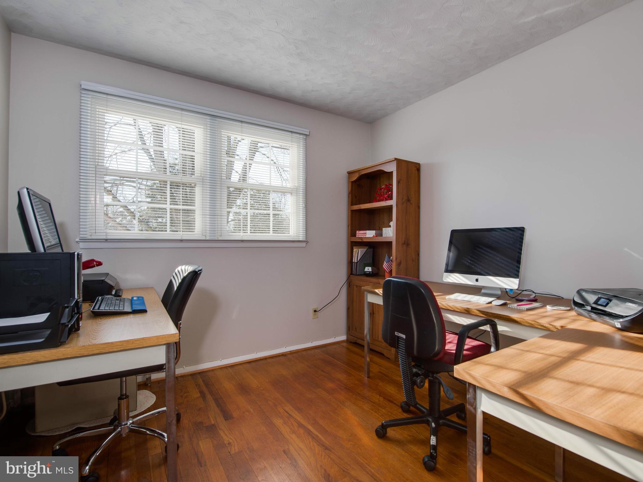 5223 Cather Road Springfield, VA 22151 - Photo 12 of 22 a view of a workspace with furniture and a window