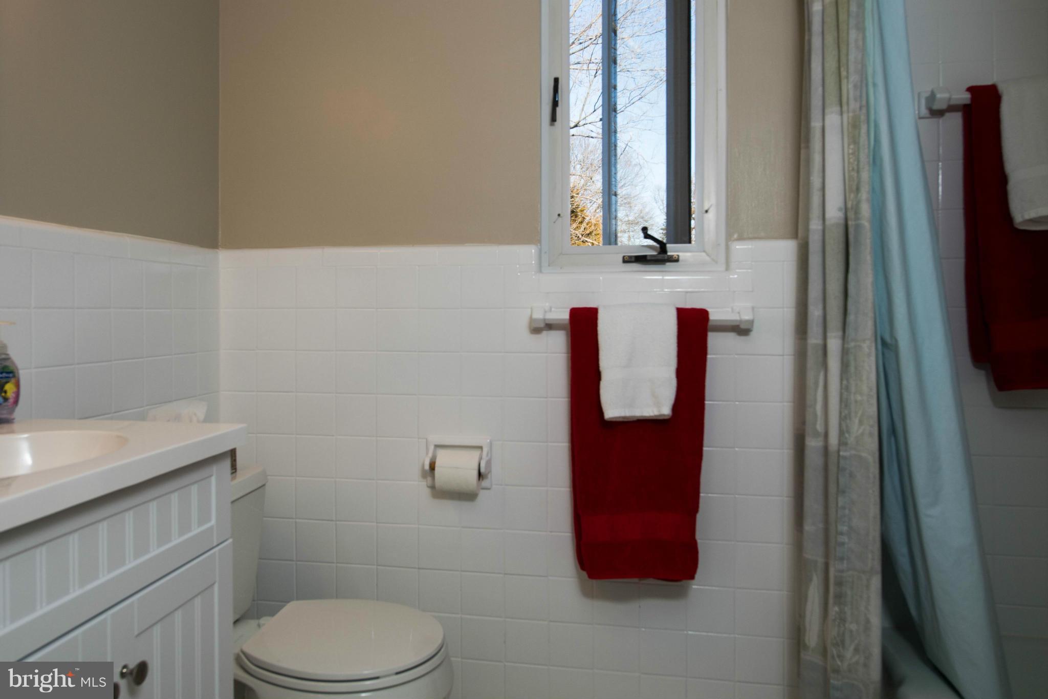 5223 Cather Road Springfield, VA 22151 - Photo 13 of 22 a bathroom with a toilet and a shower