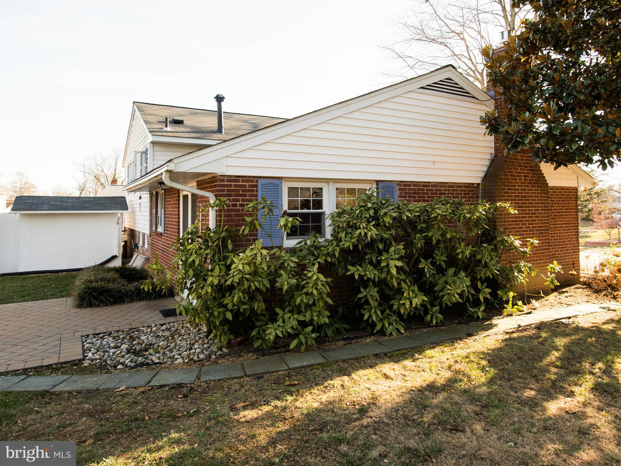 5223 Cather Road Springfield, VA 22151 - Photo 17 of 22 a view of a house with a yard