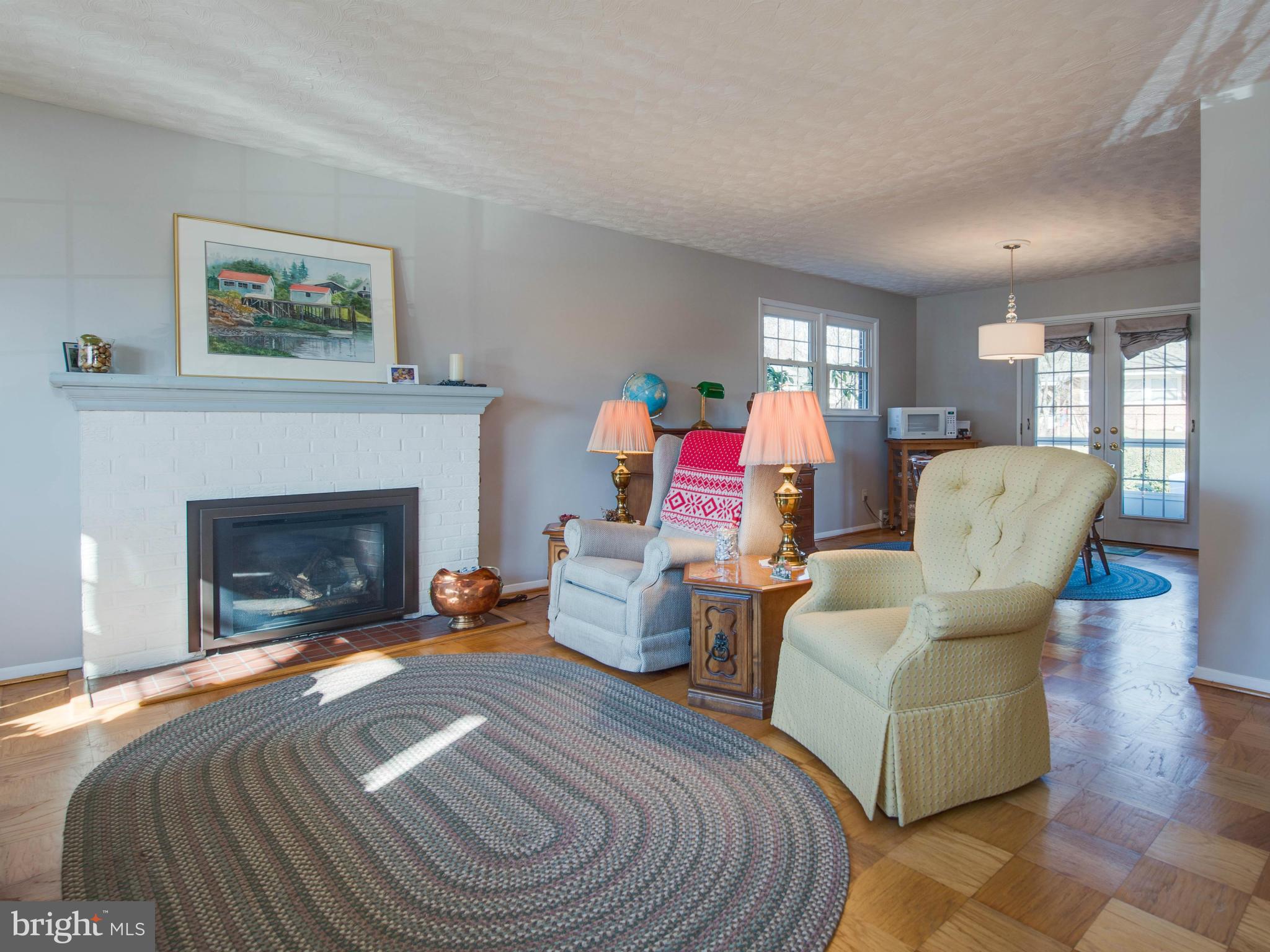 5223 Cather Road Springfield, VA 22151 - Photo 4 of 22 a living room with furniture and a fireplace