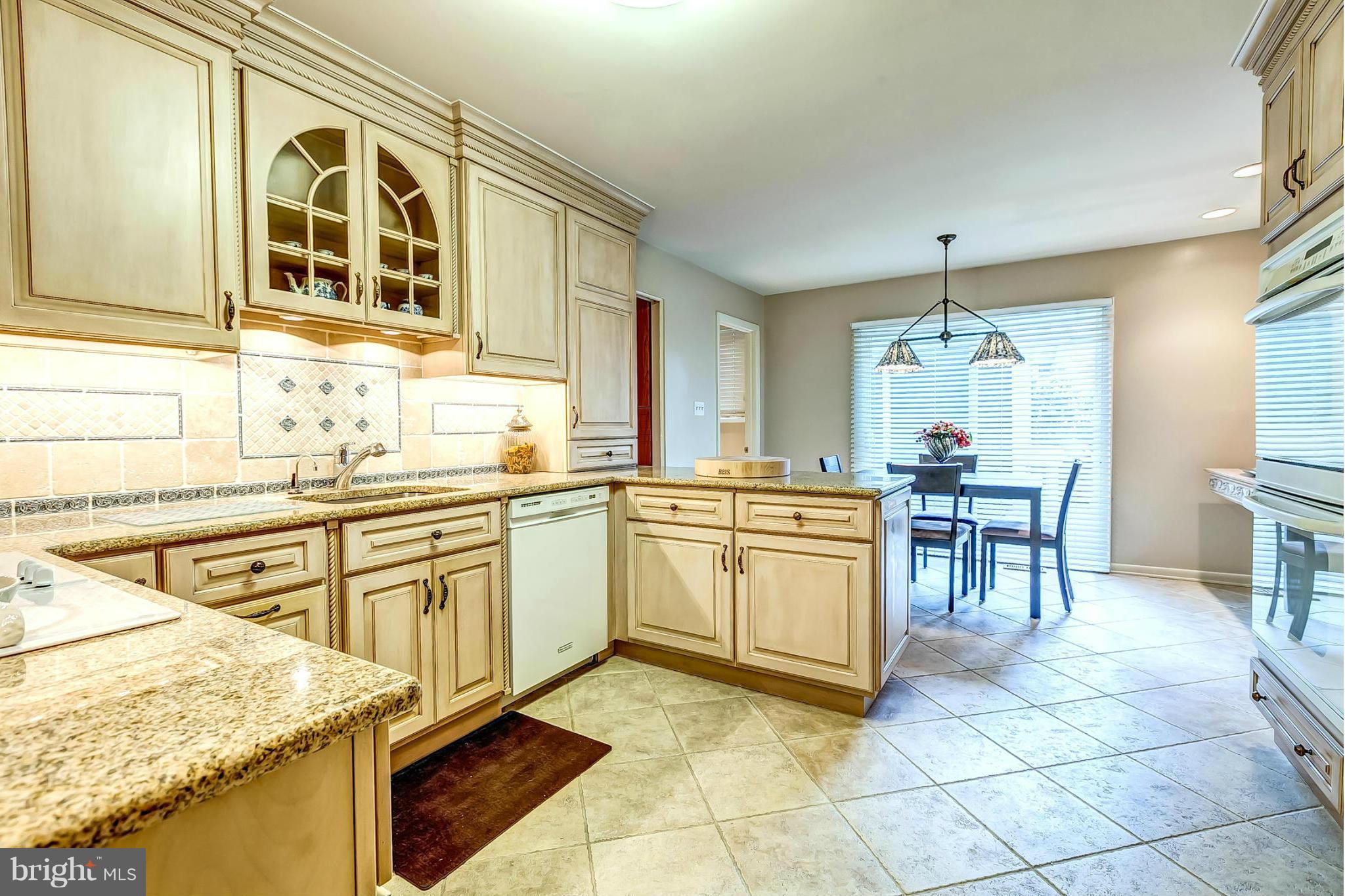 2104 Burdock Road Baltimore, MD 21209 - Photo 5 of 30 Kitchen with Custom Cabinets and Backsplash