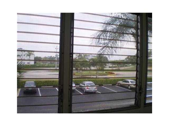 21 Suffolk A, Unit 21 Boca Raton, FL 33434 - Photo 7 of 7 a picture of a glass door and the window
