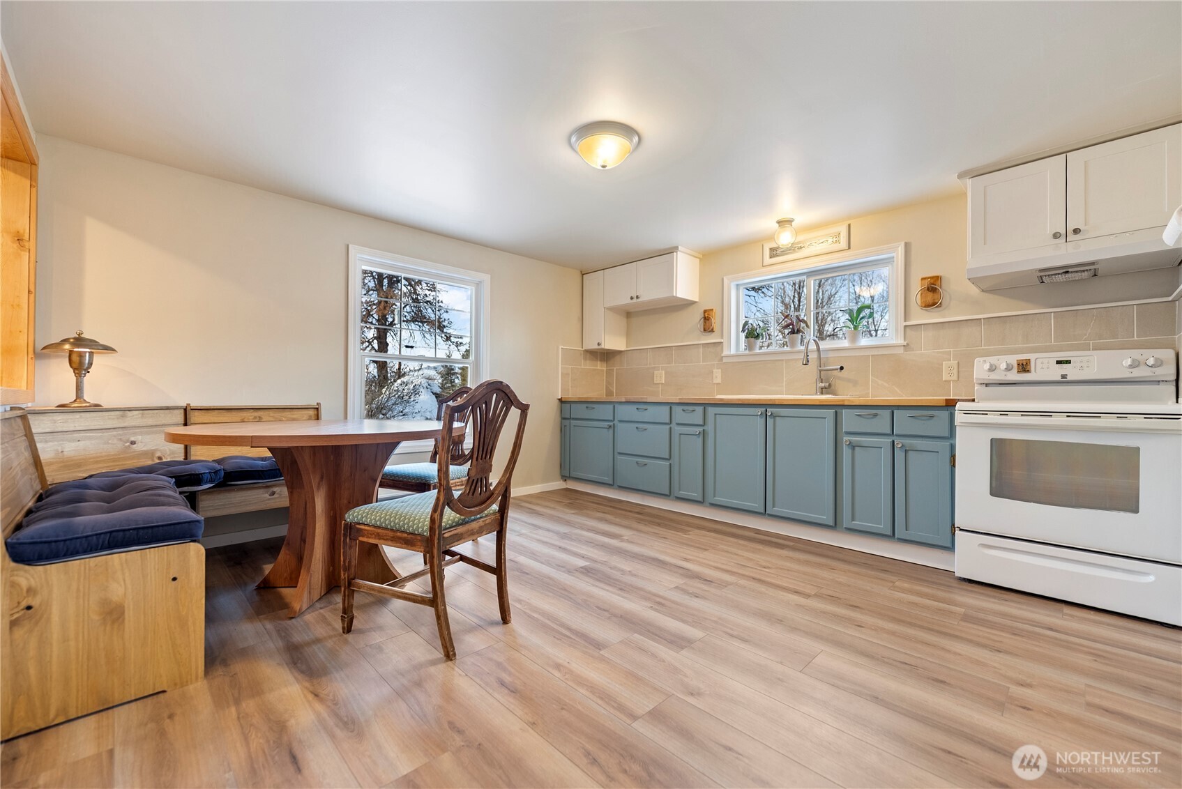 146 East Chewuch Road Winthrop, WA 98862 - Photo 19 of 39 a kitchen with a cabinets and wooden floor